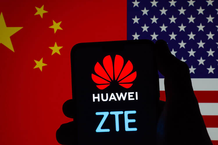 Huawei and ZTE logos with the Chinese and American flags