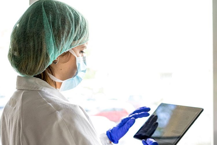 A nurse training on a 5G device.
