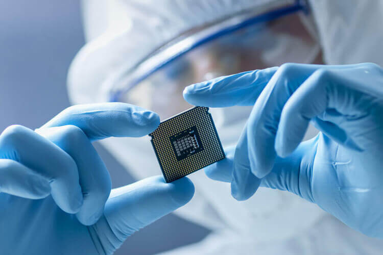 A man holding a semiconductor